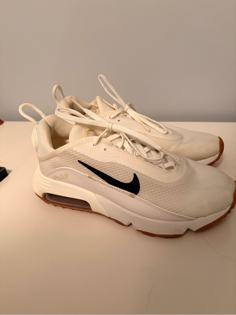 Nike Women’s Sneakers in White with Black Swoosh and Gum Outsole